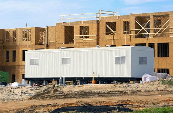 crane lifting modular building for construction office rentals in Sherwood, MI